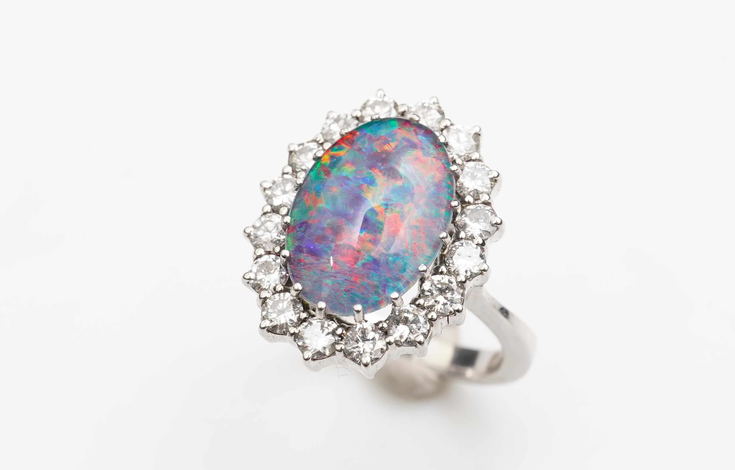 An opal triplet and diamond ring